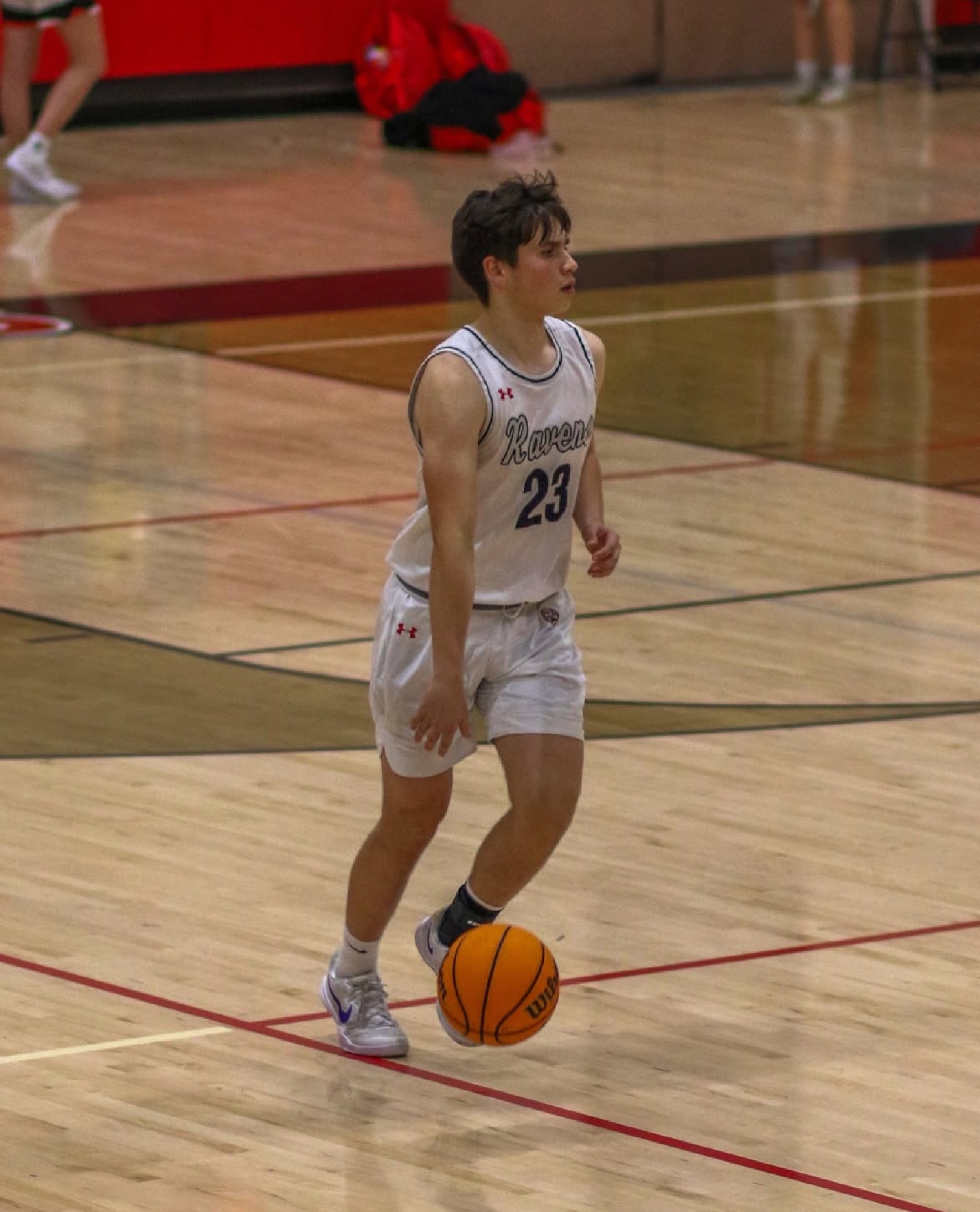 Jacques Godard brings the ball up court for Canyon Crest Academy