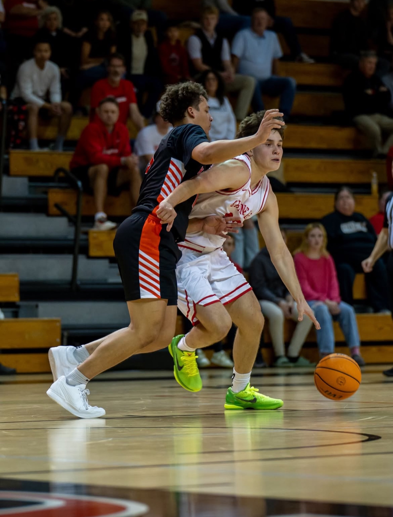 Jacques Godard drives along the baseline for Grinnell College